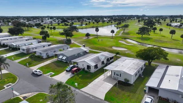 an aerial view of a house with a ocean view