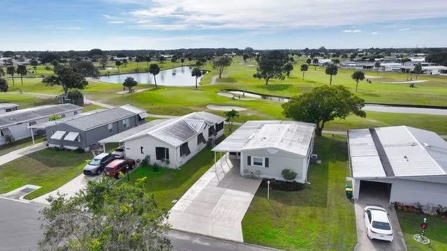 an aerial view of a house with big yard