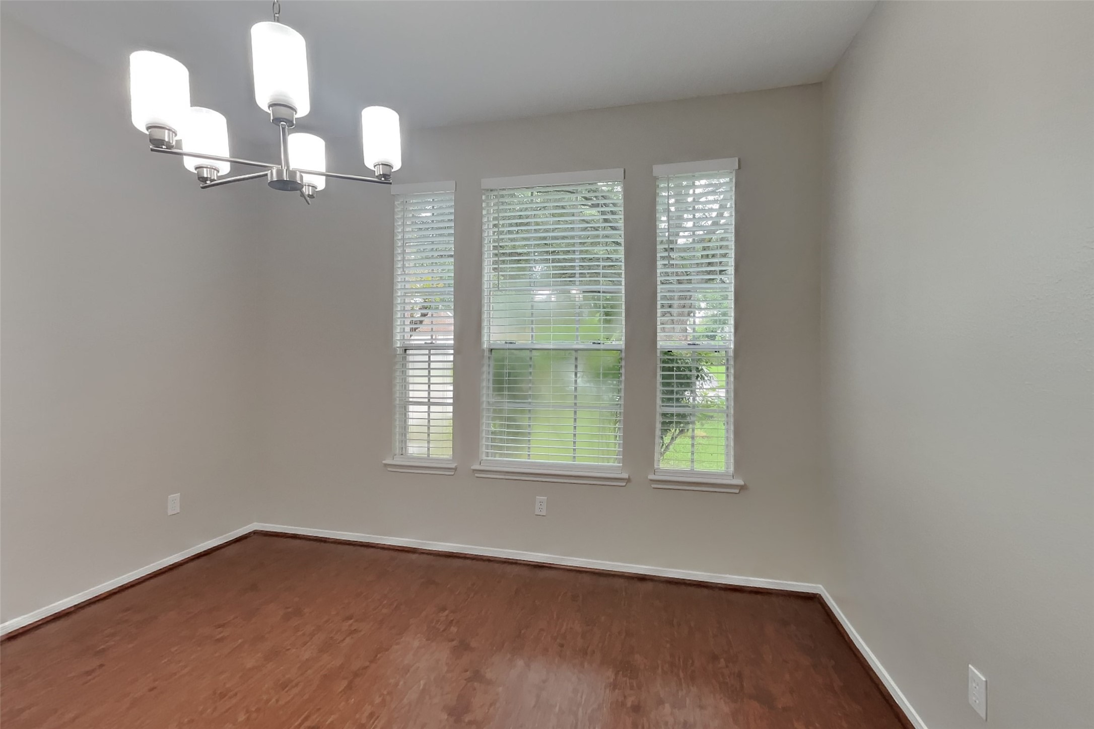 619 Bending Bough Drive Spring, TX 77388 - Photo 5 of 22 a view of an empty room with wooden floor and a window