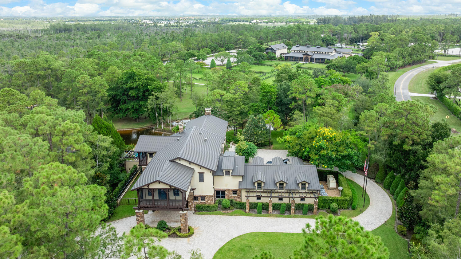 6259 Homeland Road Lake Worth, FL 33449 - Photo 20 of 62 an aerial view of a house with a garden