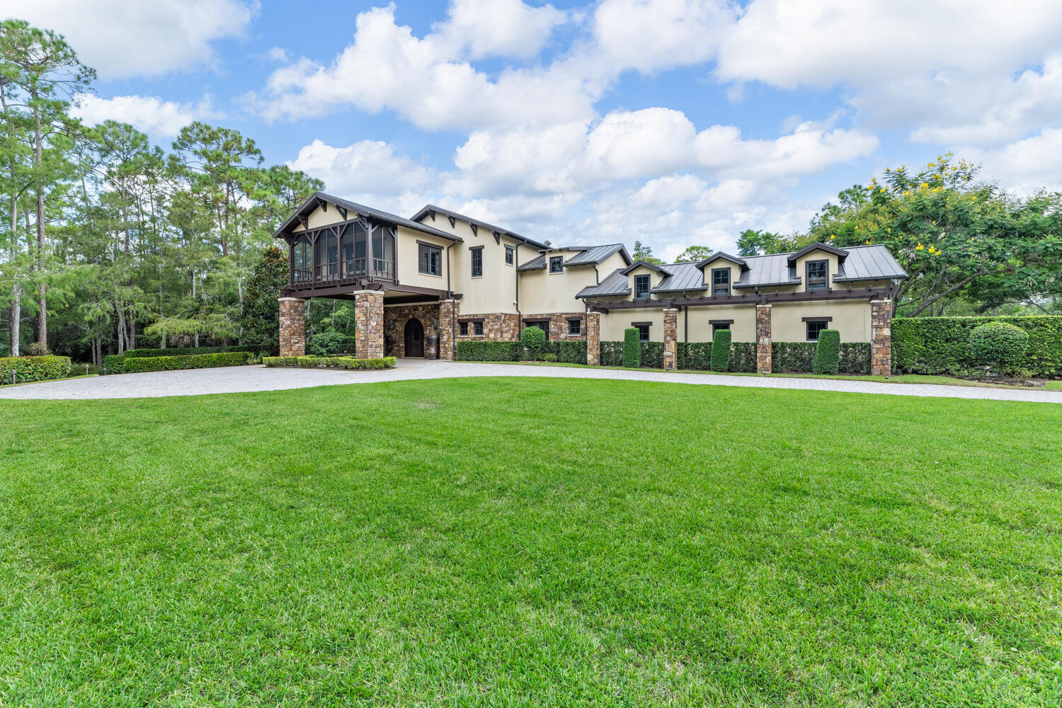 6259 Homeland Road Lake Worth, FL 33449 - Photo 21 of 62 a front view of a house with a garden and trees