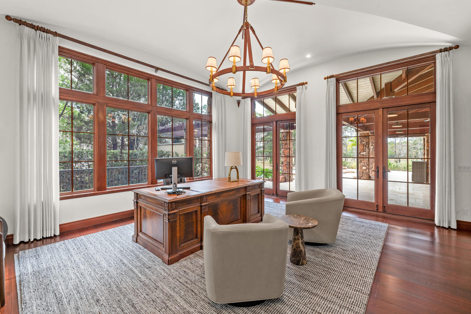 6259 Homeland Road Lake Worth, FL 33449 - Photo 27 of 62 a living room with furniture a floor to ceiling window and wooden floor