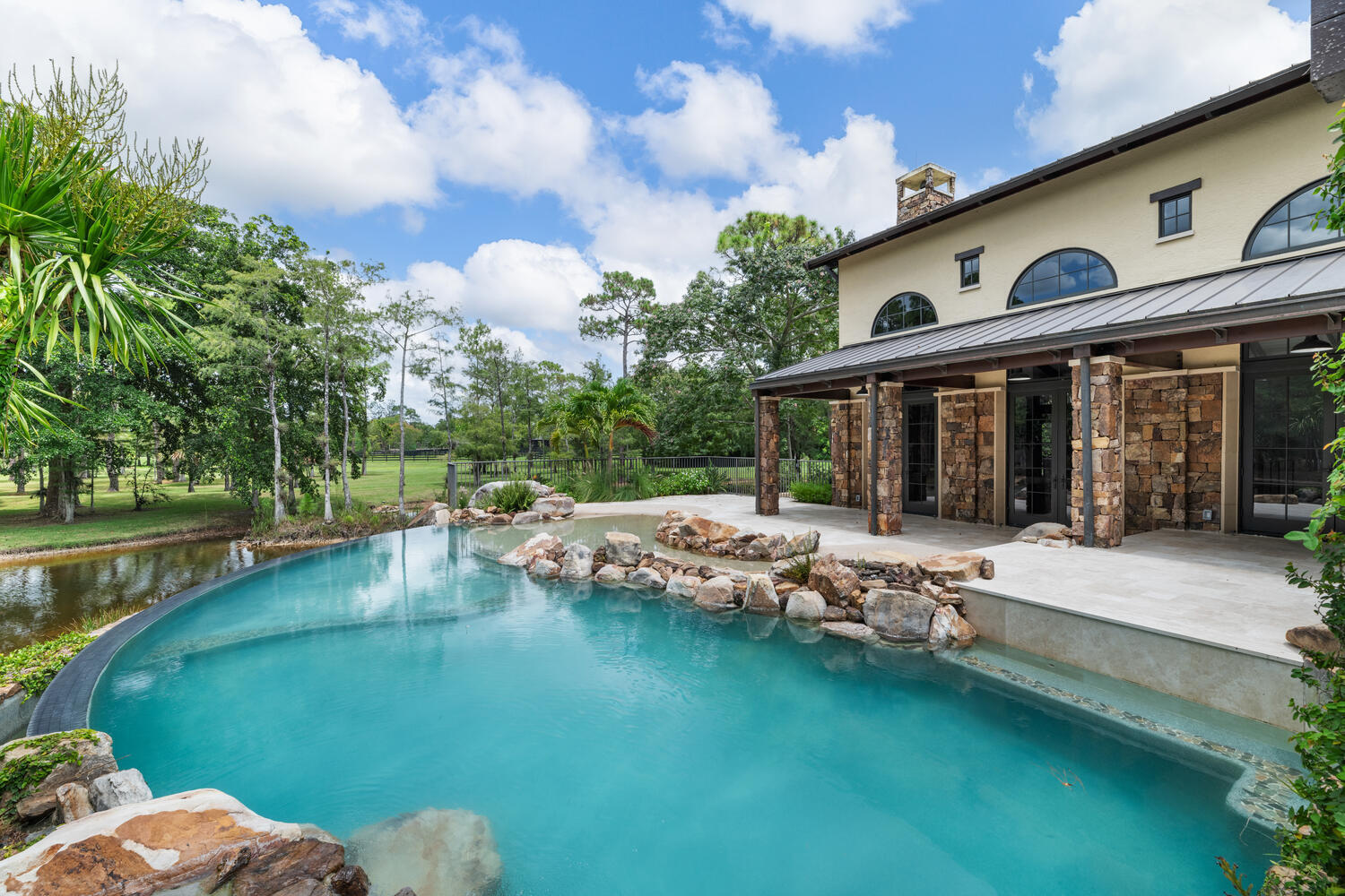 6259 Homeland Road Lake Worth, FL 33449 - Photo 41 of 62 a view of a house with pool and chairs
