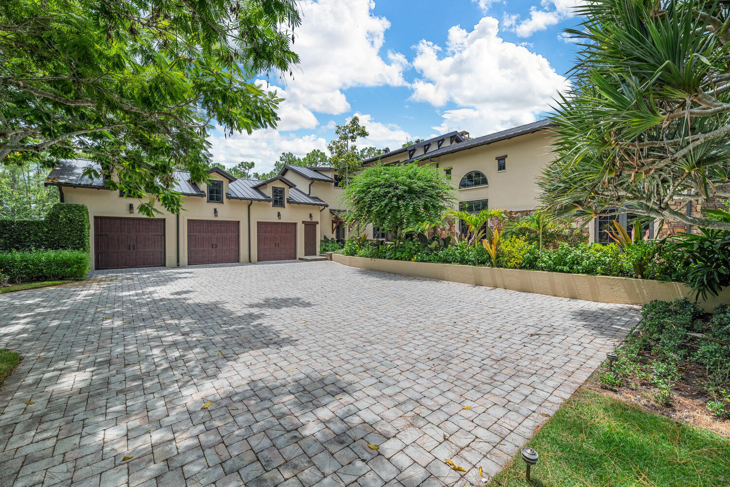 6259 Homeland Road Lake Worth, FL 33449 - Photo 46 of 62 front view of a house with a yard and a garage