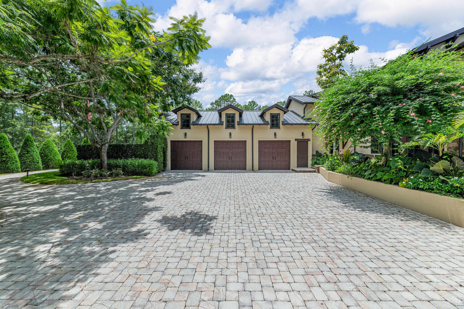 6259 Homeland Road Lake Worth, FL 33449 - Photo 47 of 62 a front view of a house with a yard and trees