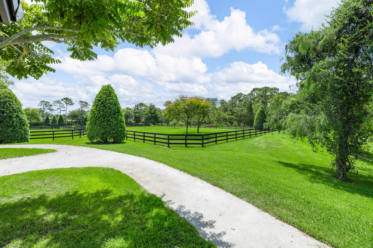 6259 Homeland Road Lake Worth, FL 33449 - Photo 49 of 62 a view of a golf course with a lake