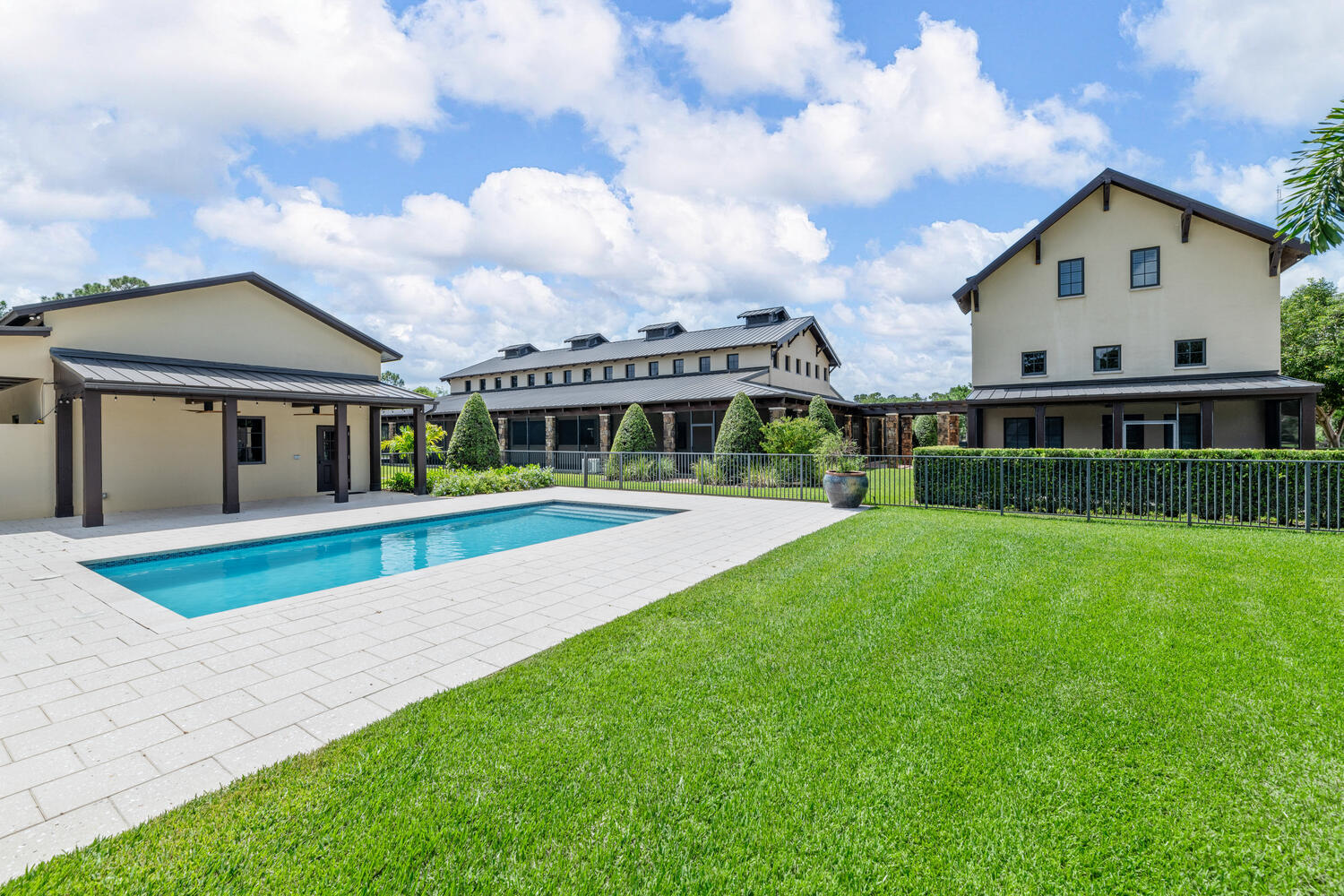 6259 Homeland Road Lake Worth, FL 33449 - Photo 52 of 62 a view of house with a big yard and large trees