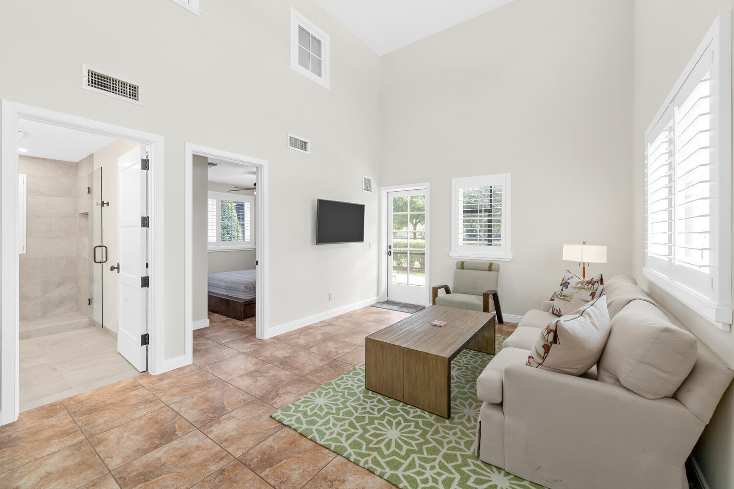 6259 Homeland Road Lake Worth, FL 33449 - Photo 60 of 62 a living room with furniture and a flat screen tv
