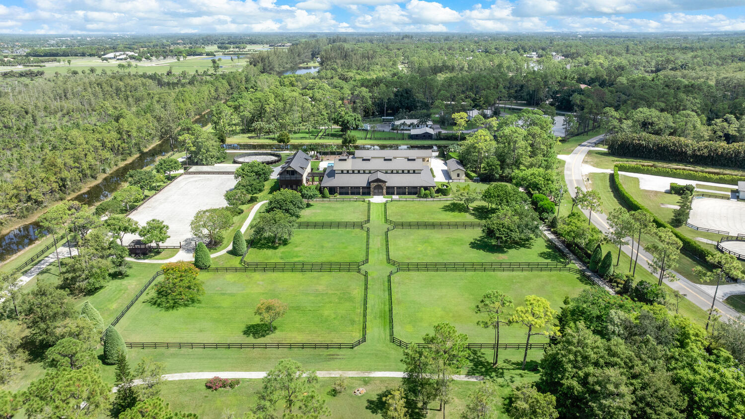 6259 Homeland Road Lake Worth, FL 33449 - Photo 6 of 62 a balcony with trees in the background