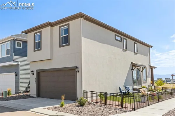 a front view of a house with garage