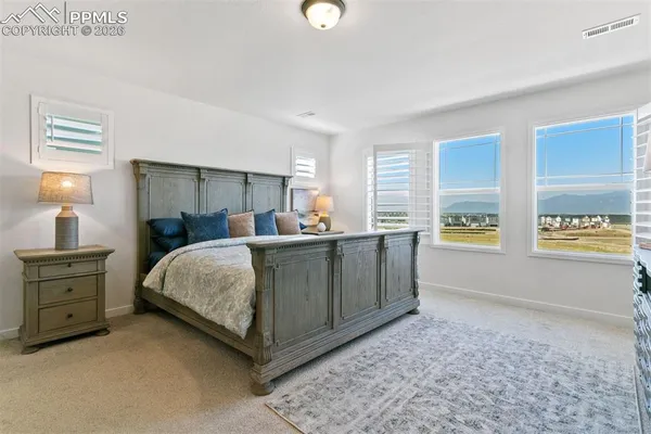 a bedroom with a bed and a cabinets