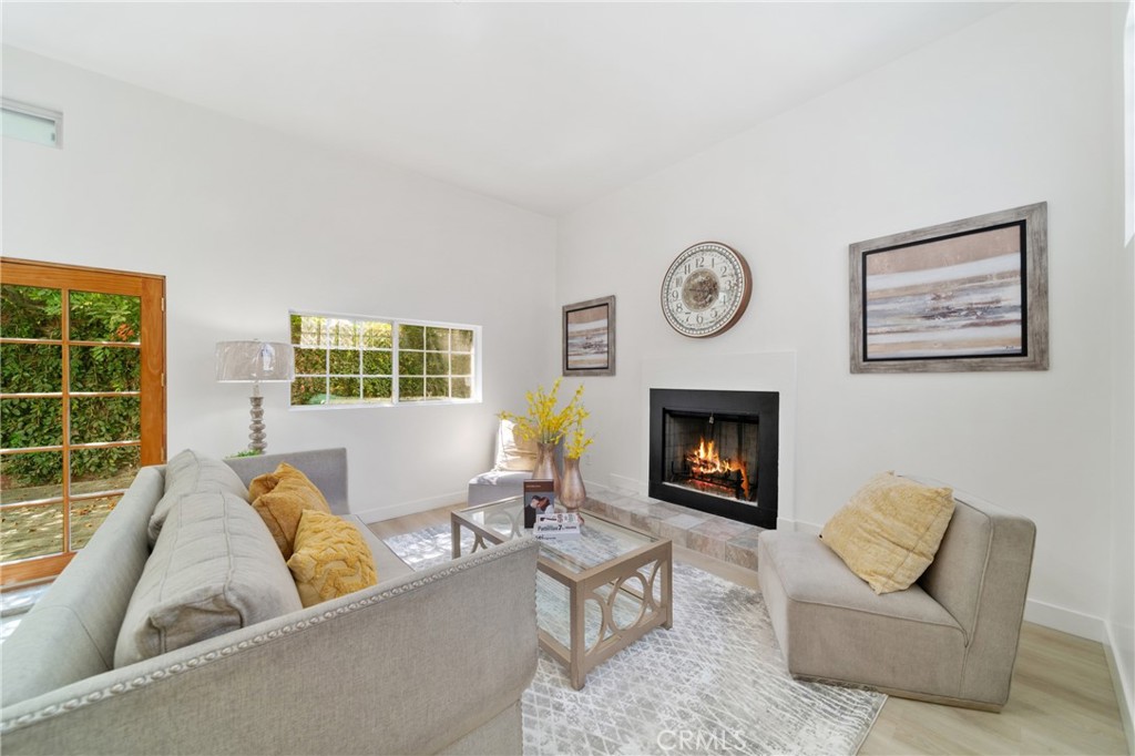347 Stedman Place Monrovia, CA 91016 - Photo 14 of 25 a living room with furniture a window and a fireplace