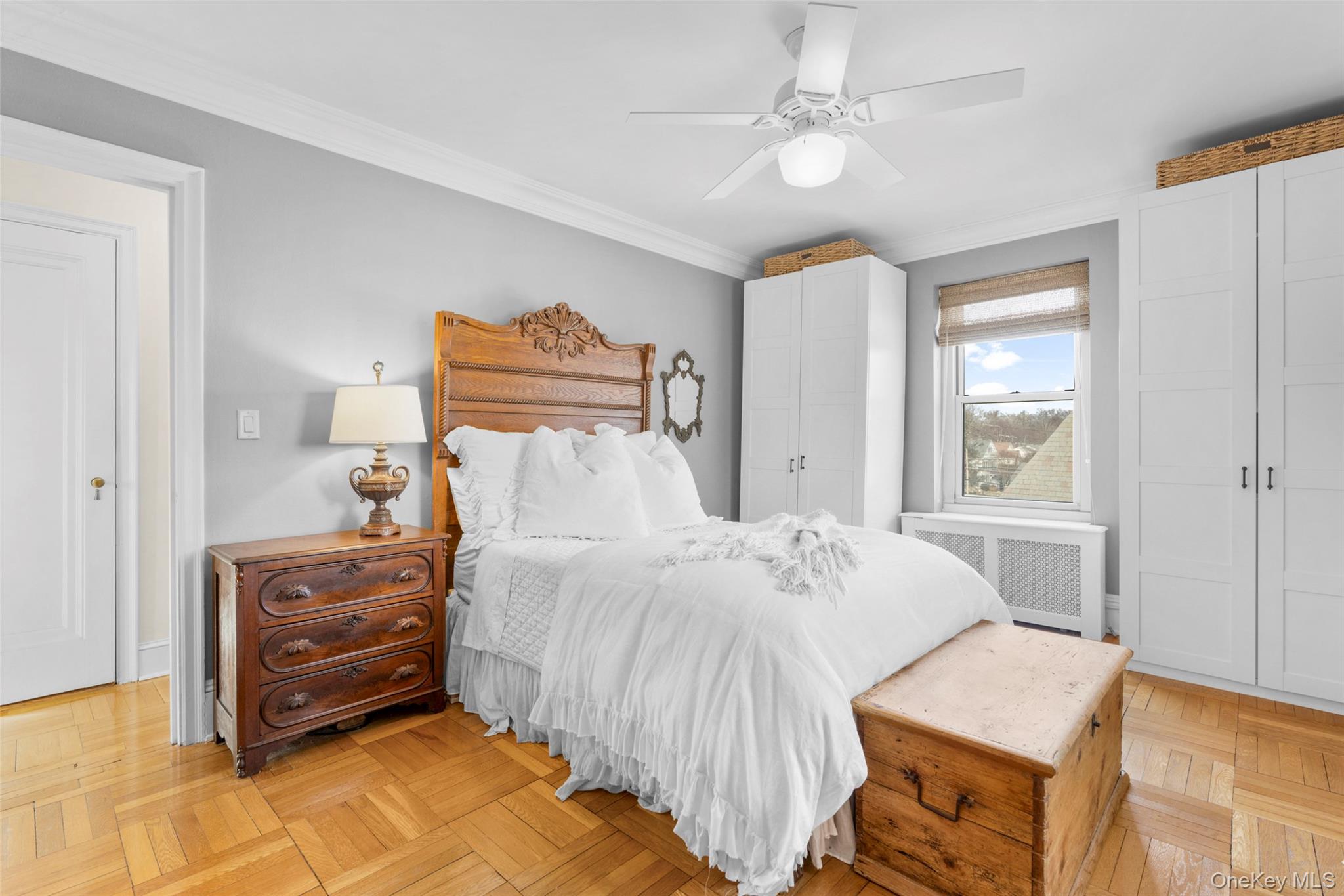 910 Stuart Avenue, Unit 4L Mamaroneck, NY 10543 - Photo 21 of 32 a bedroom with a bed and a dresser