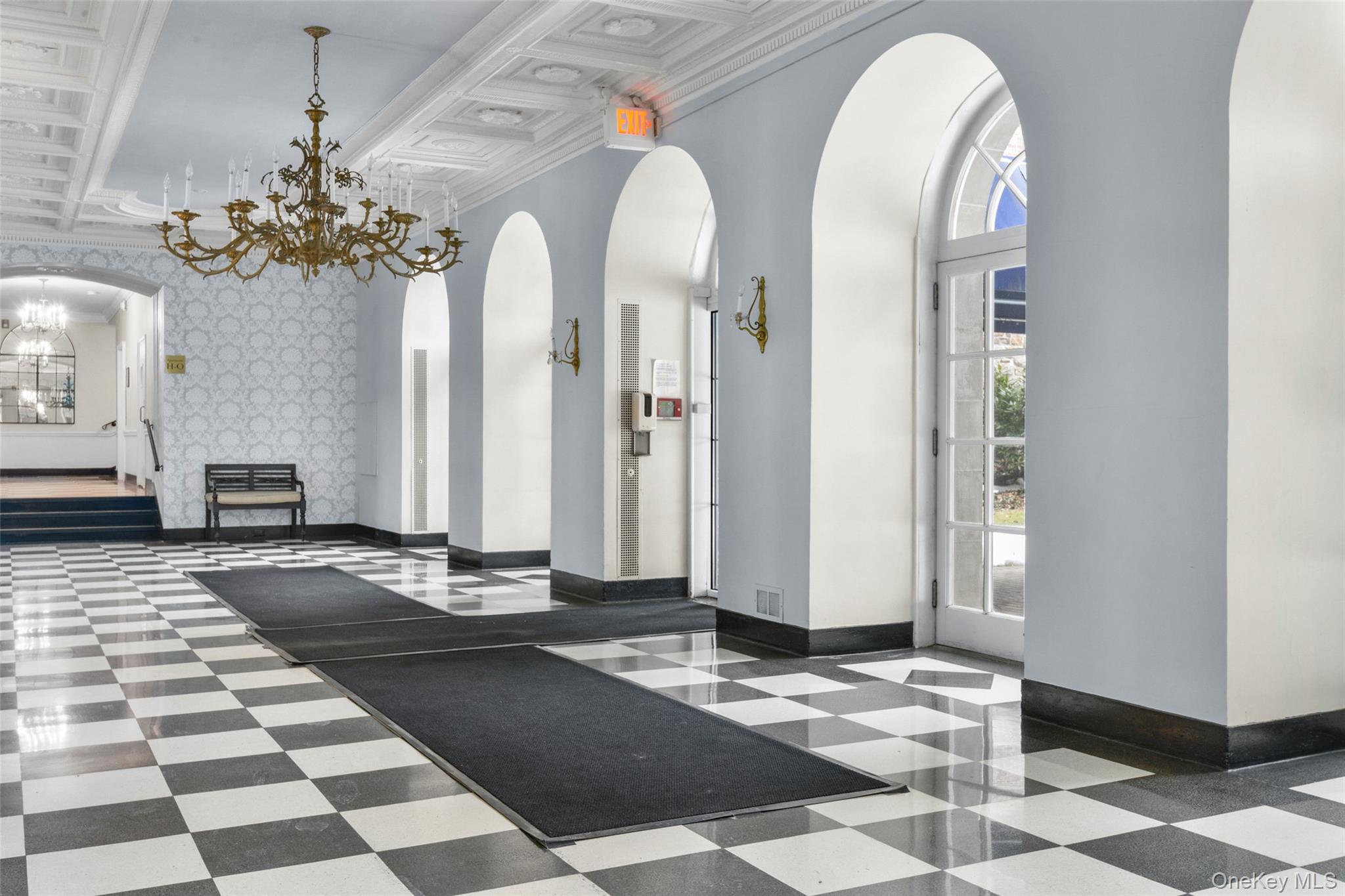 910 Stuart Avenue, Unit 4L Mamaroneck, NY 10543 - Photo 26 of 32 a view of hall way with furniture and chandelier