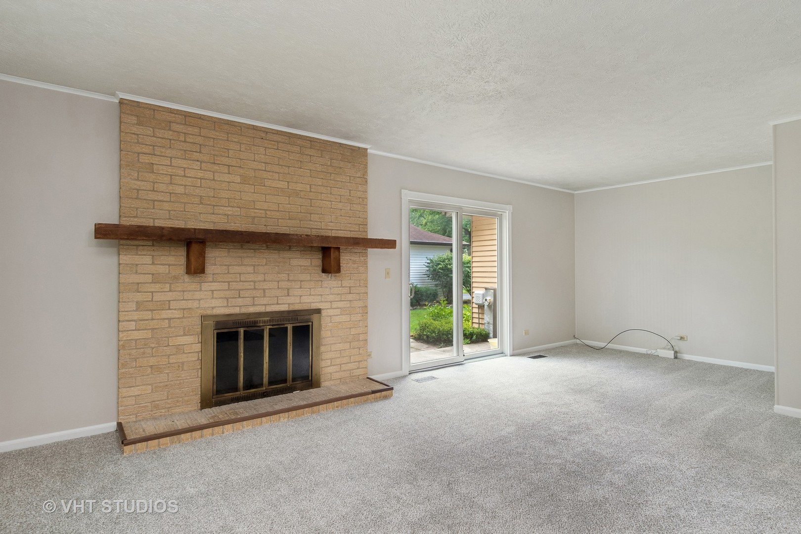 412 Quarry Drive Bolingbrook, IL 60490 - Photo 11 of 23 a view of empty room with a fireplace