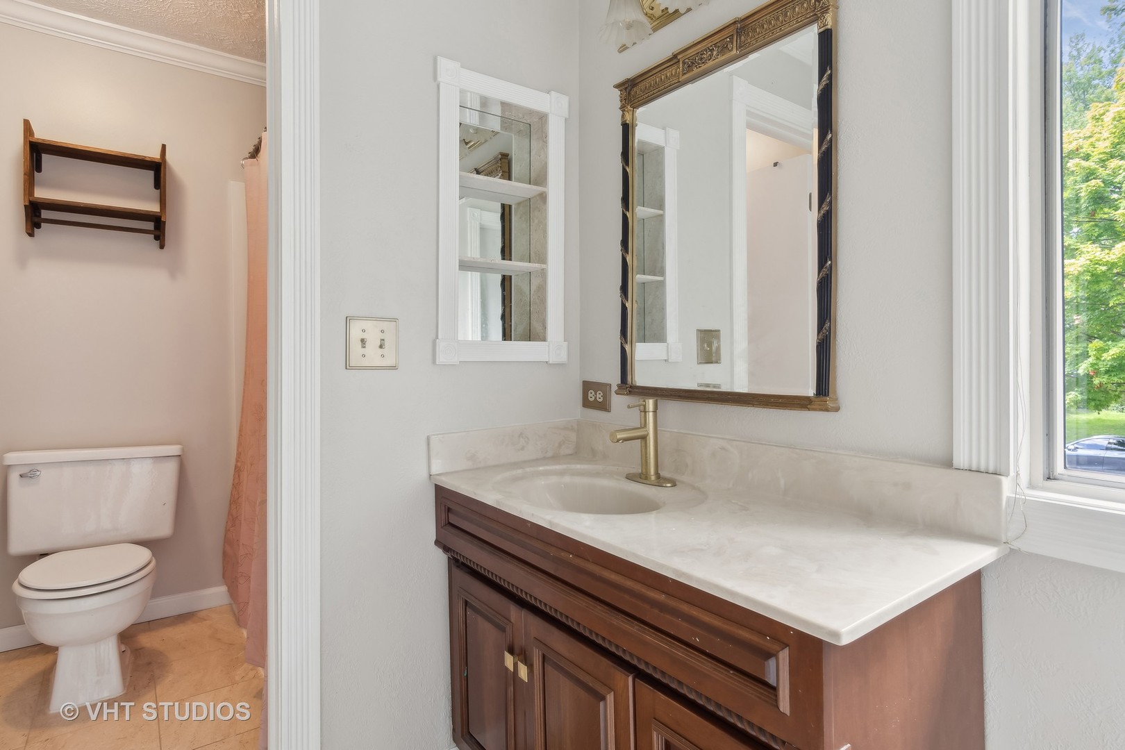 412 Quarry Drive Bolingbrook, IL 60490 - Photo 13 of 23 a bathroom with a sink a toilet and a mirror