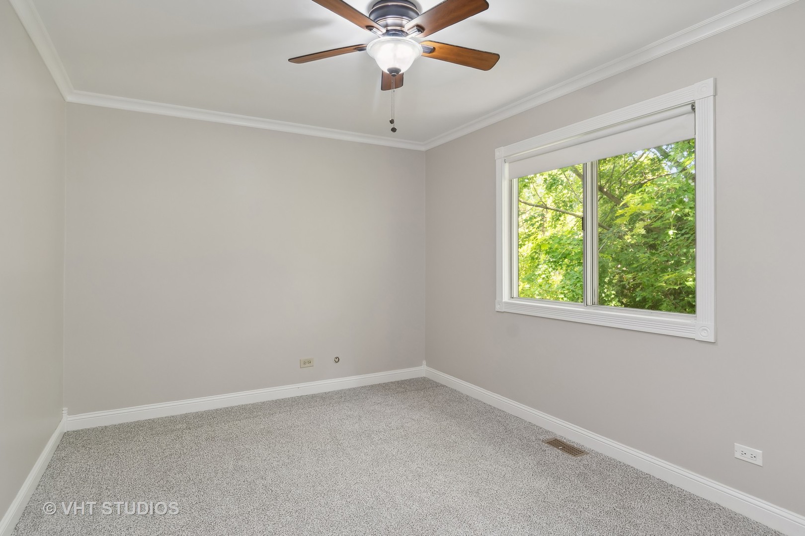 412 Quarry Drive Bolingbrook, IL 60490 - Photo 15 of 23 an empty room with a window and a fan