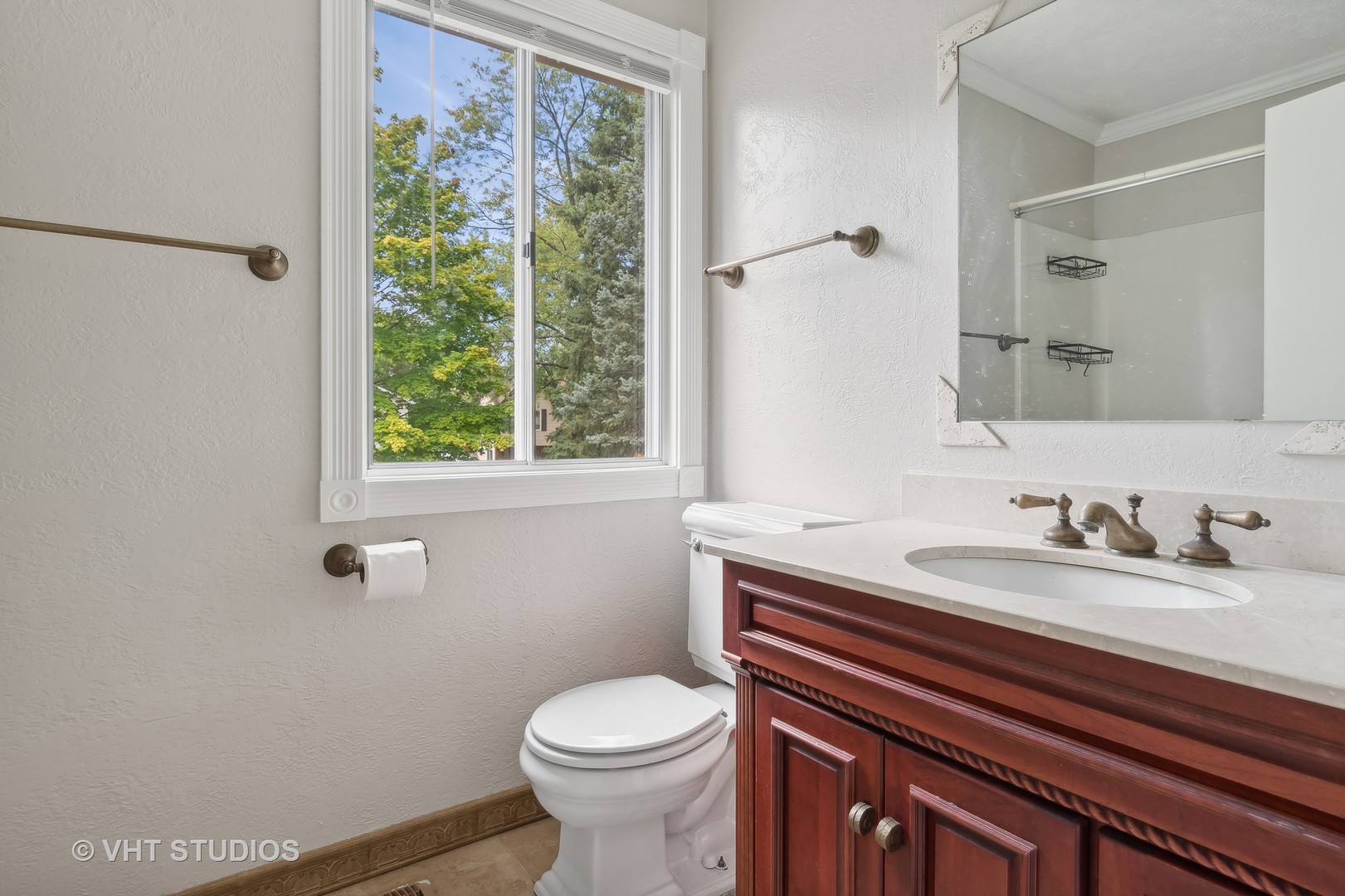 412 Quarry Drive Bolingbrook, IL 60490 - Photo 18 of 23 a bathroom with a granite countertop toilet sink and mirror