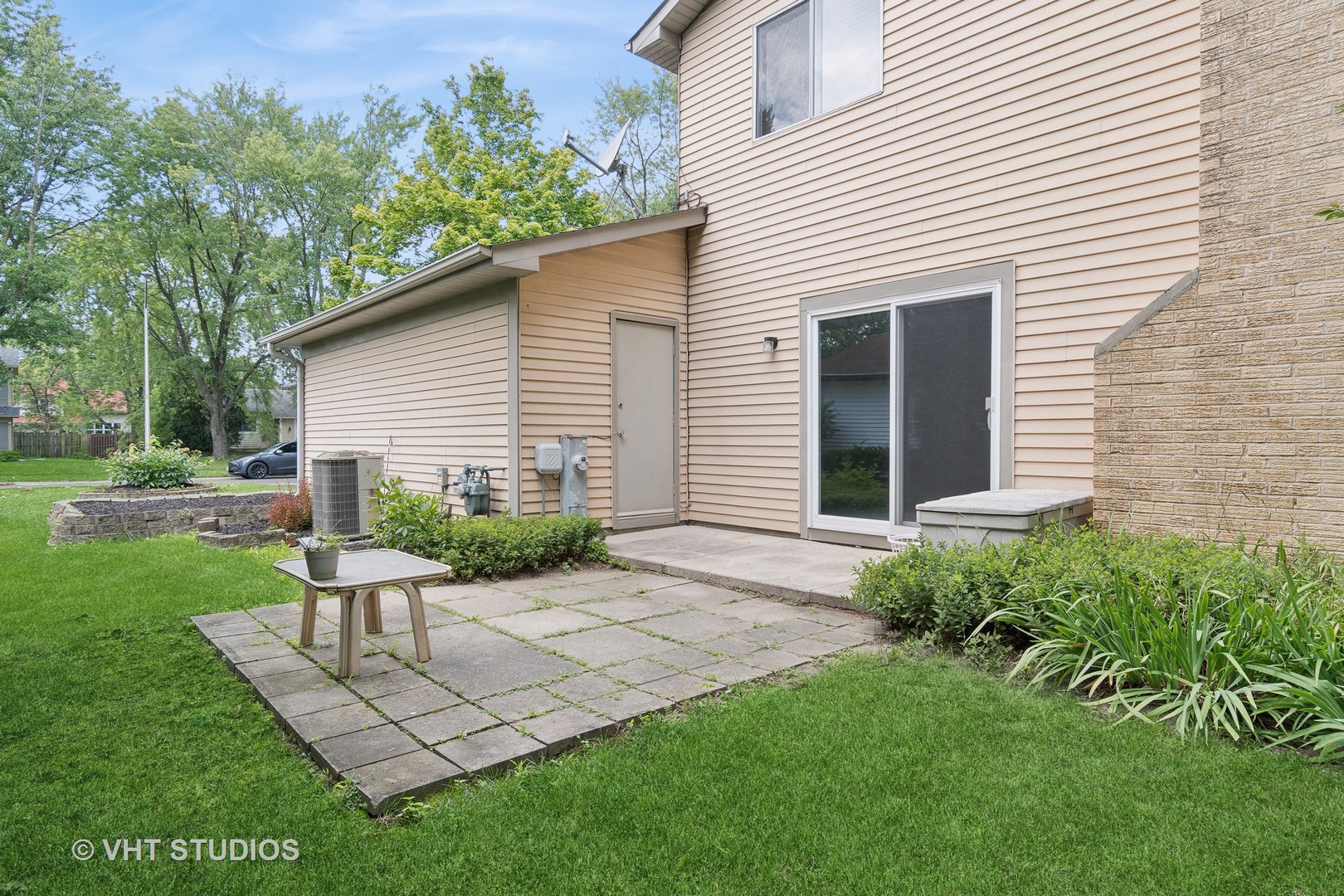 412 Quarry Drive Bolingbrook, IL 60490 - Photo 20 of 23 a view of a chair and table in backyard of the house