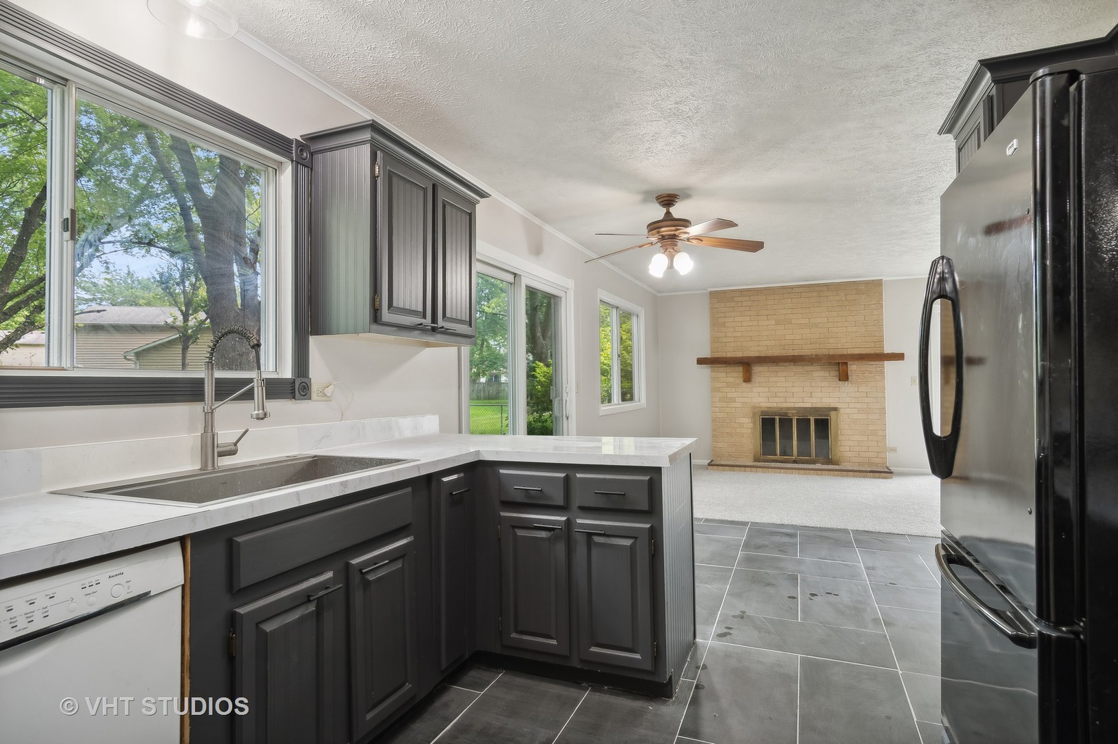 412 Quarry Drive Bolingbrook, IL 60490 - Photo 7 of 23 a kitchen with a sink appliances and cabinets