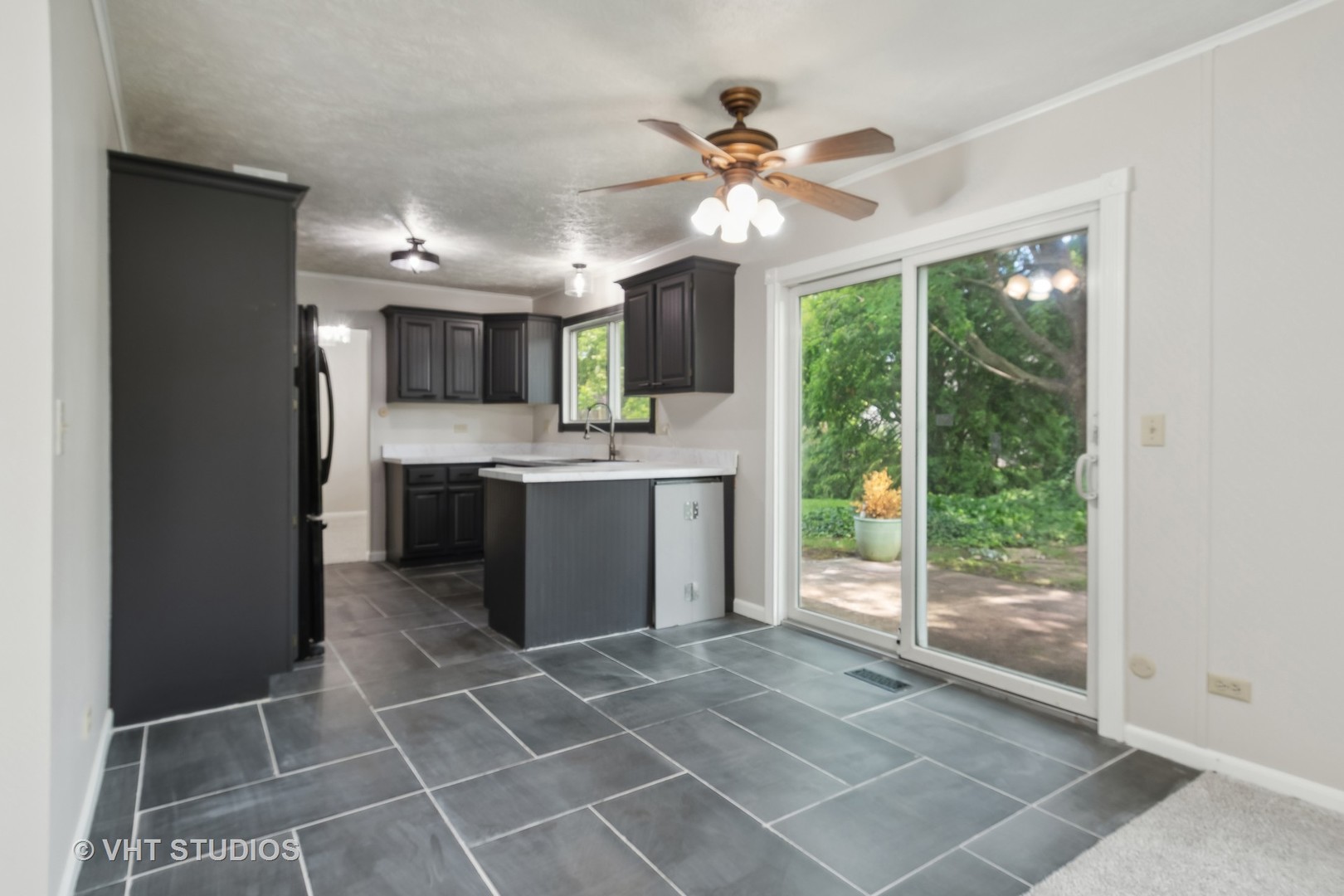 412 Quarry Drive Bolingbrook, IL 60490 - Photo 8 of 23 a view of a kitchen with a sink and a window