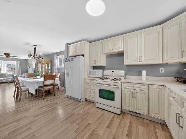 a kitchen with a stove a sink and a refrigerator