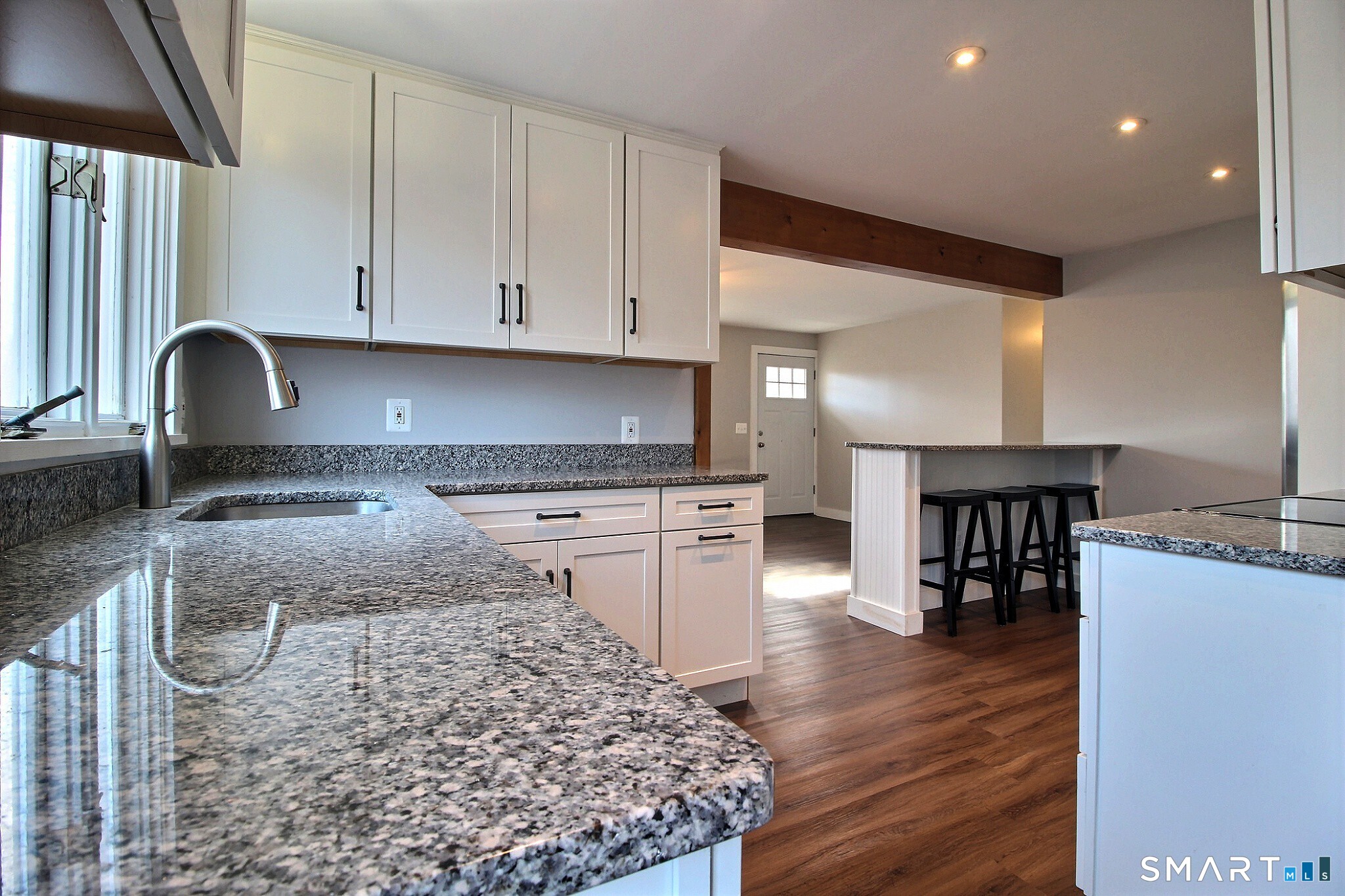 179 North Anguilla Road Stonington, CT 06379 - Photo 14 of 21 a kitchen with stainless steel appliances granite countertop a stove a sink and a microwave