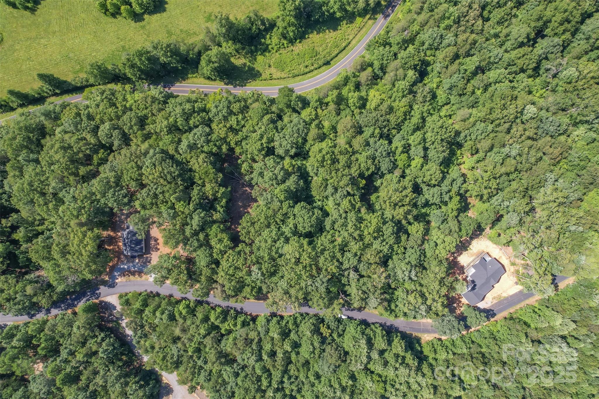 Lot 6 South Cross Creek Trail Mill Spring Mill Spring, NC 28756 - Photo 8 of 10 an aerial view of a house with a yard and outdoor seating