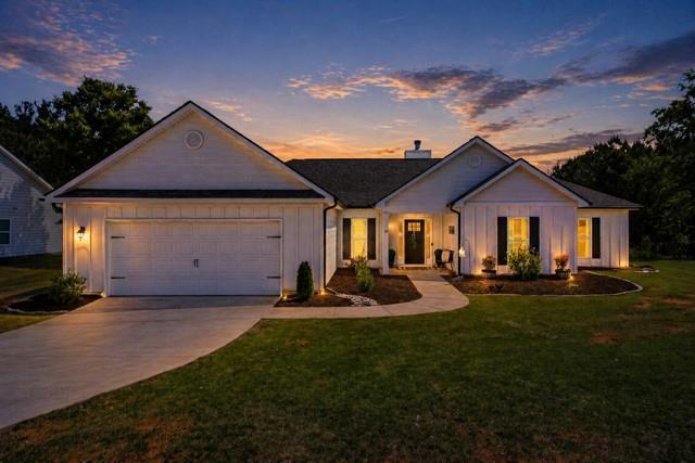 189 Marie Court Bethlehem, GA 30620 - Photo 1 of 57 a front view of a house with a yard fire pit and outdoor seating