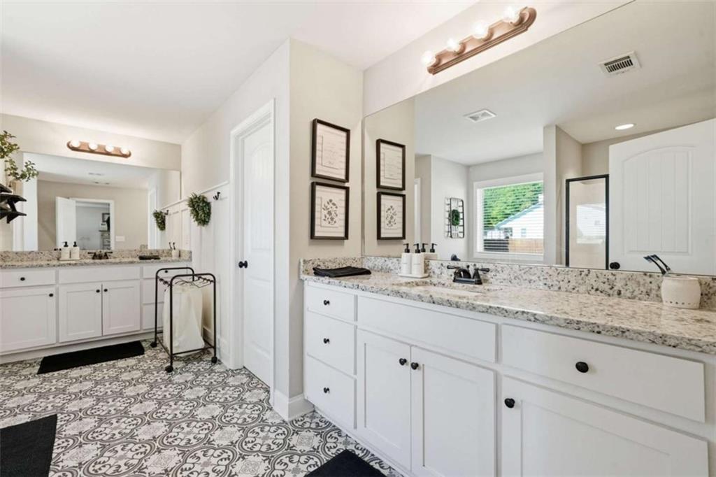 189 Marie Court Bethlehem, GA 30620 - Photo 13 of 57 a bathroom with a sink and a mirror