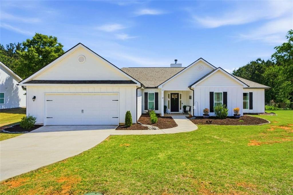 189 Marie Court Bethlehem, GA 30620 - Photo 2 of 57 a front view of house with yard and outdoor seating
