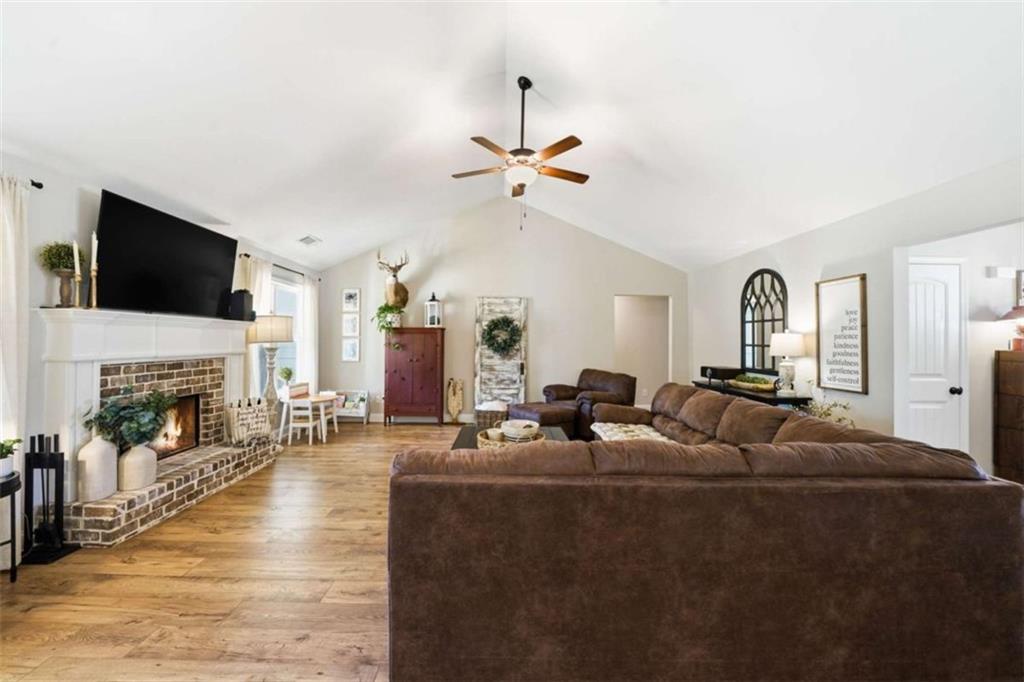 189 Marie Court Bethlehem, GA 30620 - Photo 33 of 57 a living room with furniture fireplace and a flat screen tv