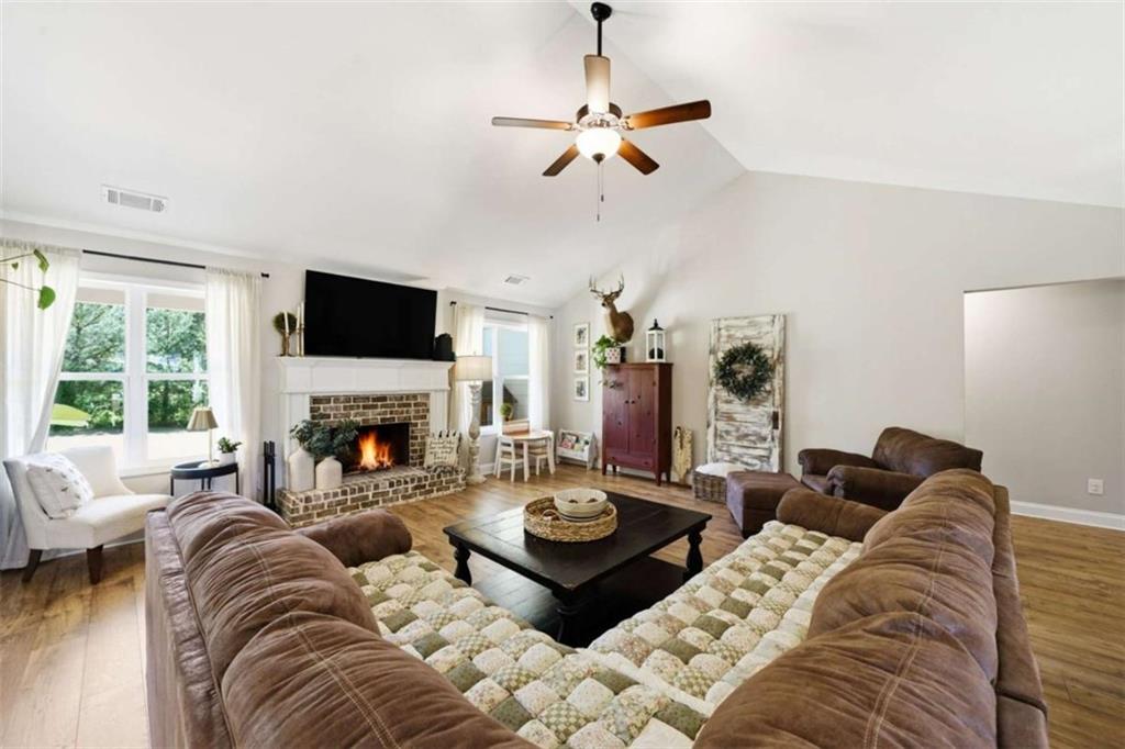 189 Marie Court Bethlehem, GA 30620 - Photo 35 of 57 a living room with furniture fireplace and a large window