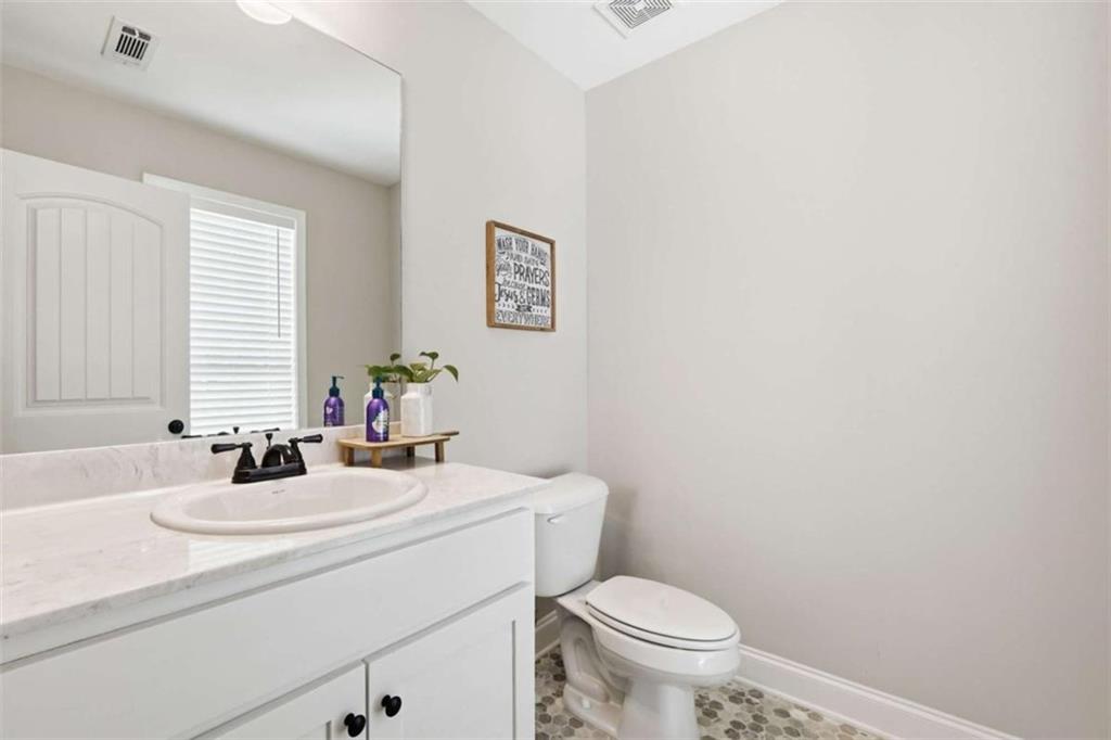 189 Marie Court Bethlehem, GA 30620 - Photo 54 of 57 a bathroom with a sink a toilet and mirror