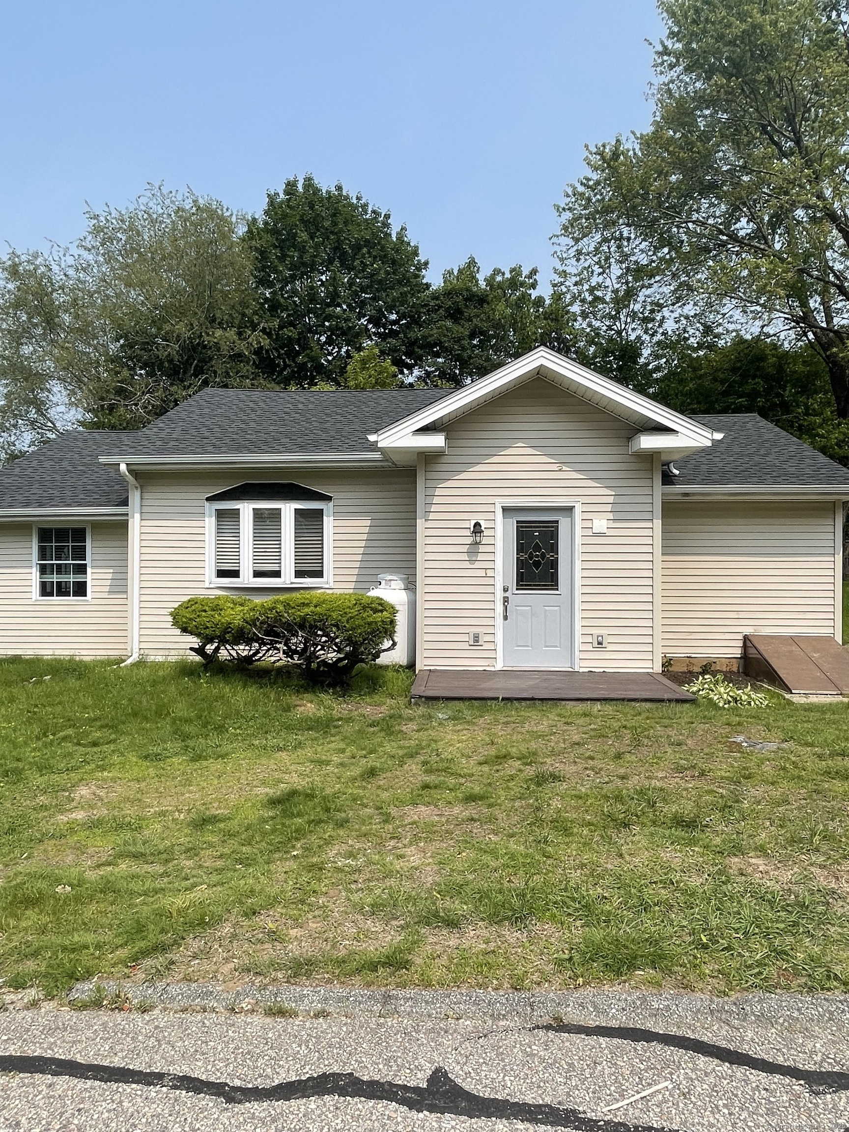 a front view of a house with garden