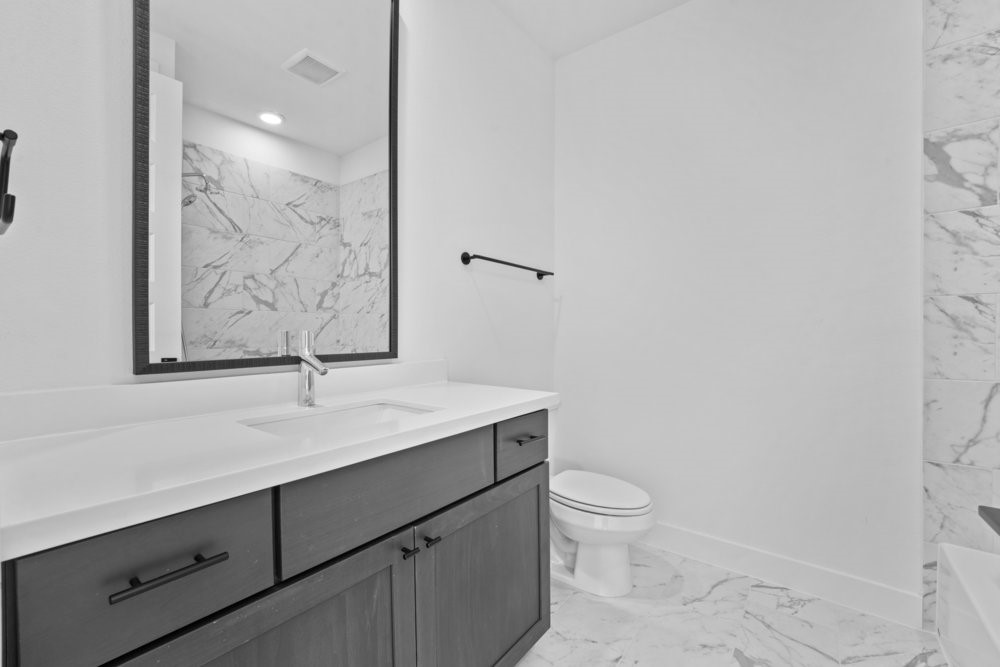 5001 Childers Path Austin, TX 78741 - Photo 26 of 40 Bathroom with light marble finish floors and vanity