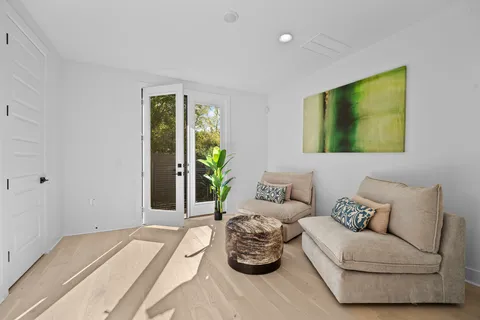 a bedroom with furniture and a window