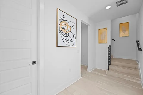 a view of front door with wooden floor