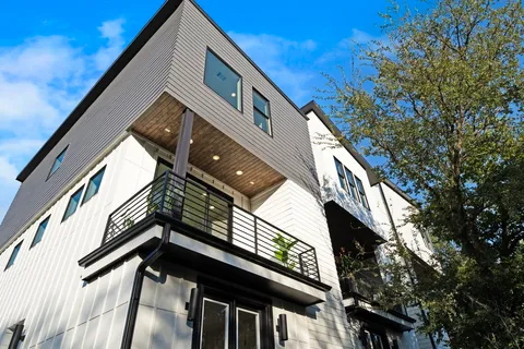 a view of balcony with a small yard