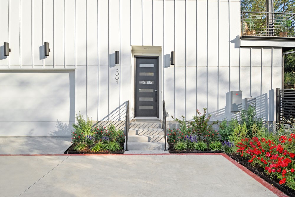 5001 Childers Path Austin, TX 78741 - Photo 7 of 40 Doorway to property with board and batten siding