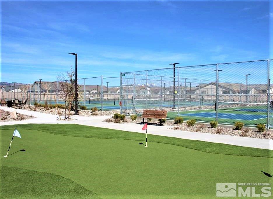 9840 Nahar Lane Reno, NV 89521 - Photo 21 of 25 a view of a swimming pool and a yard