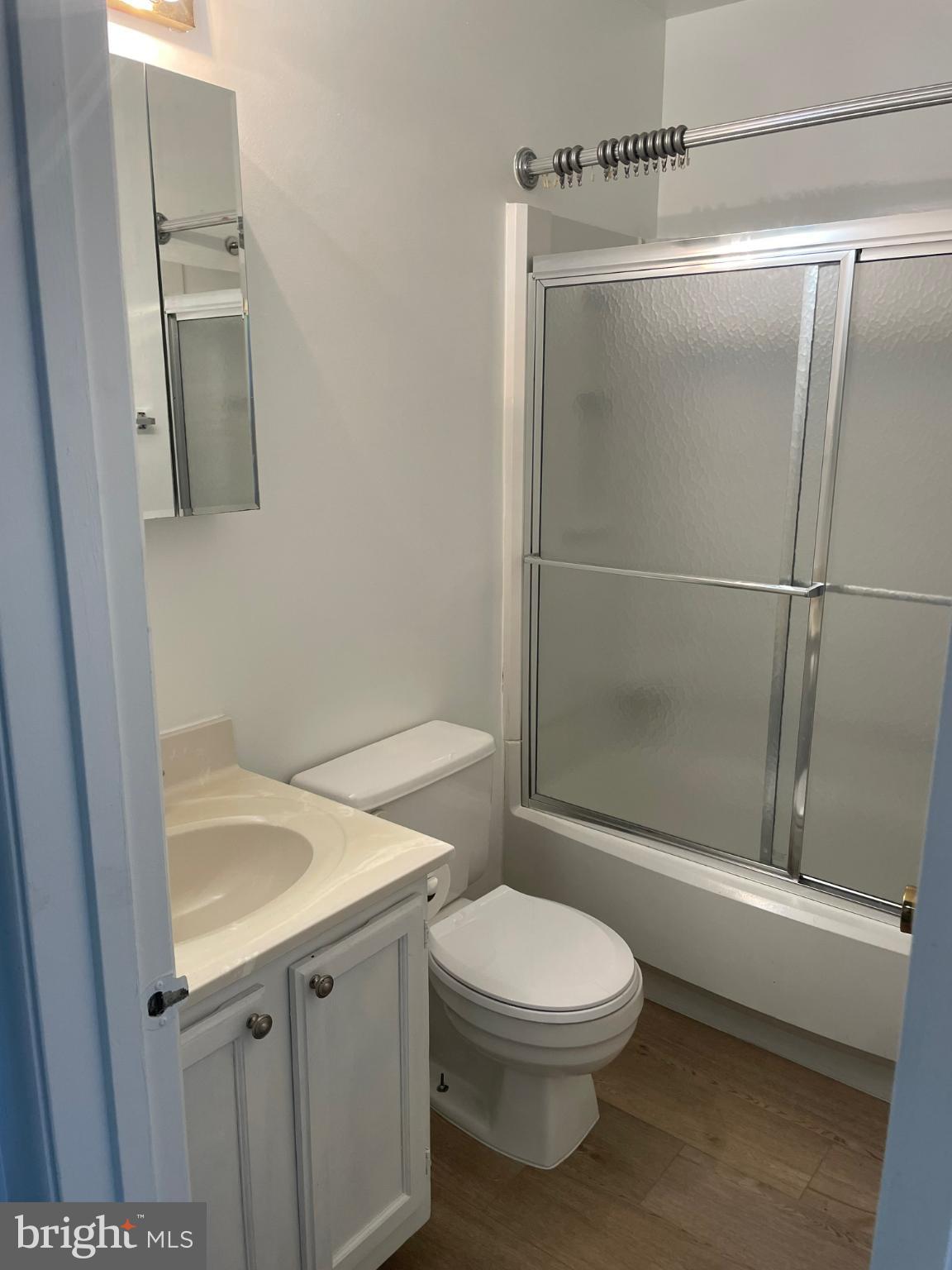11206 White Barn Court Gaithersburg, MD 20879 - Photo 10 of 21 a bathroom with a toilet a sink and shower