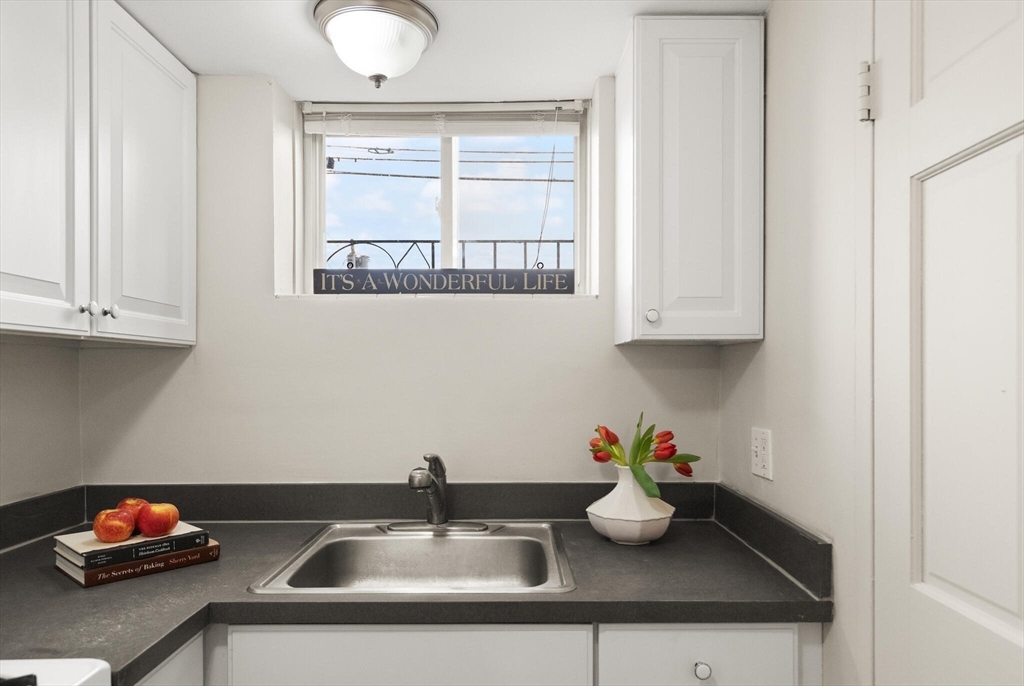 12 Central Avenue, Unit 1 Danvers, MA 01923 - Photo 13 of 25 a bathroom with a sink and a window