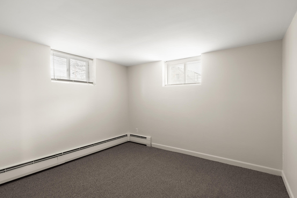 12 Central Avenue, Unit 1 Danvers, MA 01923 - Photo 14 of 25 an empty room with a workbench