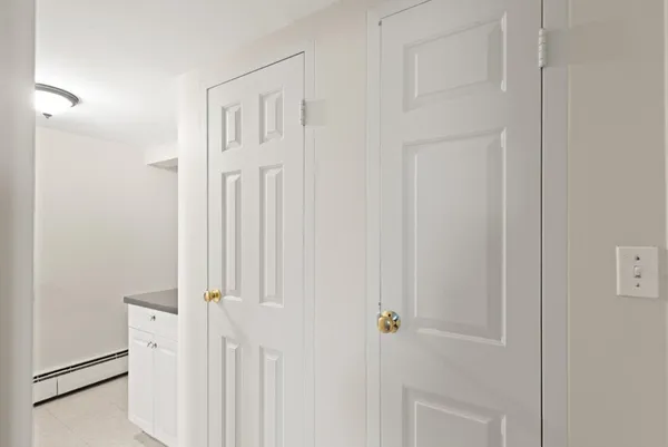 a view of a hallway with closet
