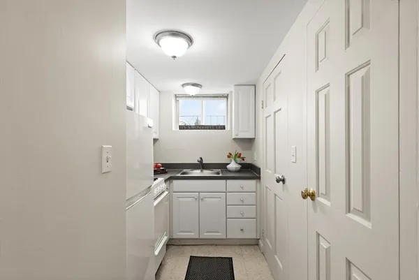 a kitchen with stainless steel appliances a stove and a refrigerator