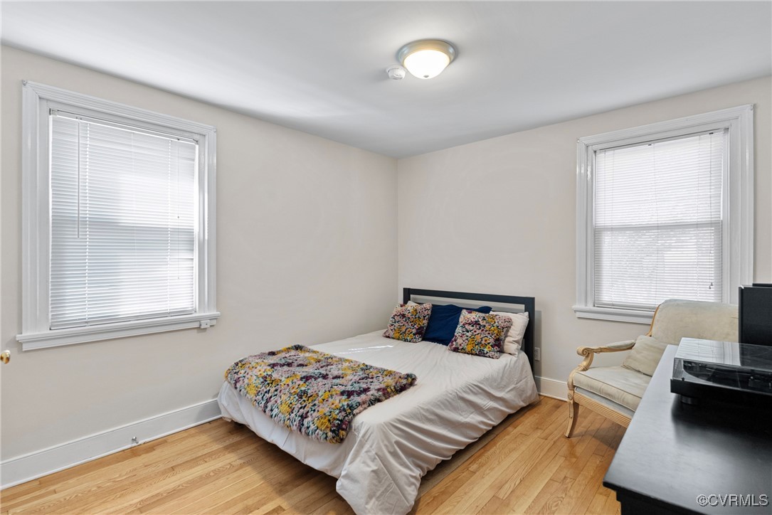 1918 Seddon Road Richmond, VA 23227 - Photo 17 of 33 Bedroom featuring wood floors, 2 windows
