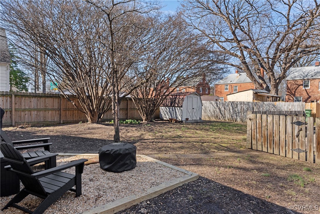 1918 Seddon Road Richmond, VA 23227 - Photo 28 of 33 View of back yard with natural stone patio, a fenc