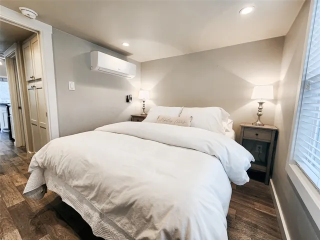 a large white bed in a white room