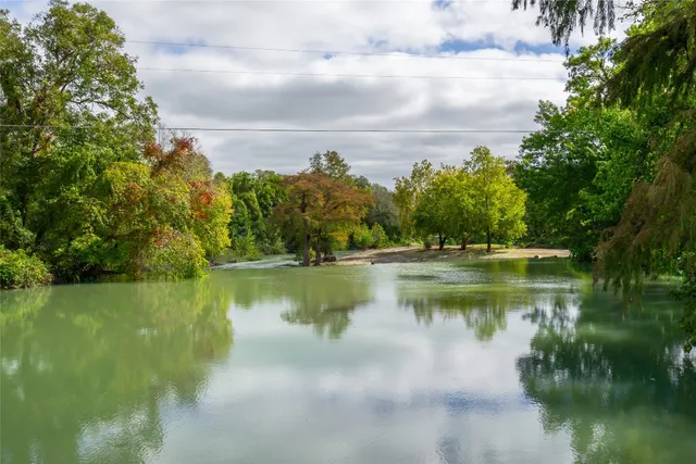 a view of outdoor space with deck and trees